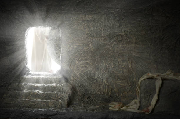 Jesus Leaving Empty Tomb Jesus leaving empty tomb while light shines from the outside easter sunday photos stock pictures, royalty-free photos & images