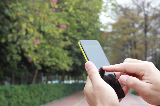 istock Hand holding mobile phone 639426020
