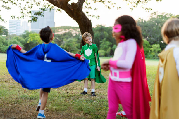 istock Superheroes Cheerful Kids Expressing Positivity Concept 639428206