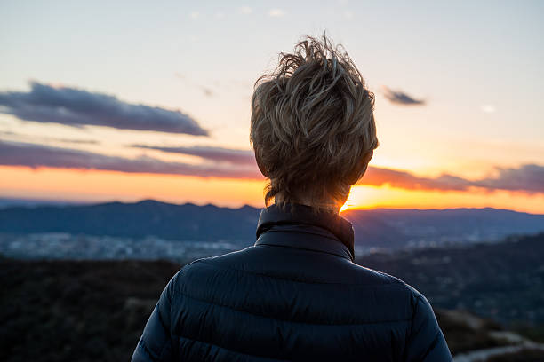 istock Woman Looking At View At Sunset 639429242