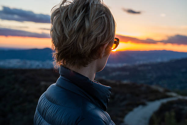 istock Woman Looking At View At Sunset 639429294