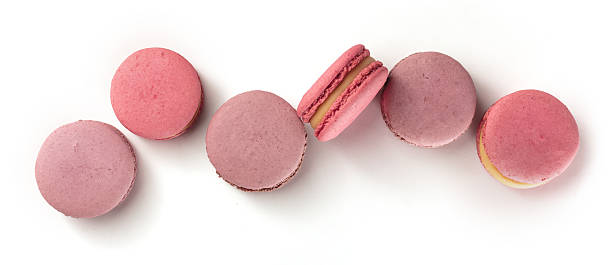 istock Pastel coloured macarons forming a row on white 639431356
