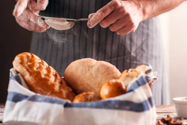 istock Unrecognizable baker finishing his pastry close-up 639433776