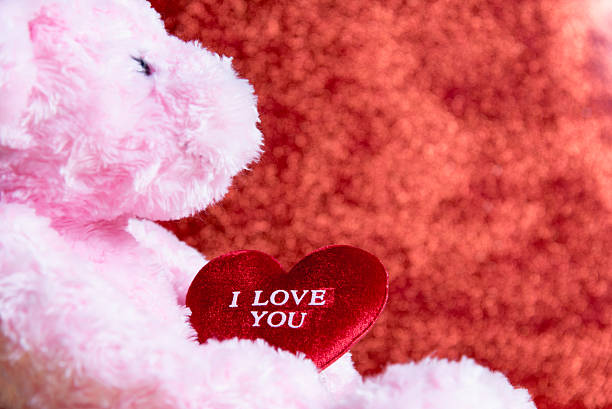 istock teddy Bear with Heart on red background,concept valentine 639439156