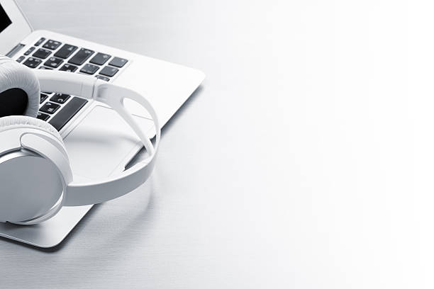 istock Headphones over laptop 639439208