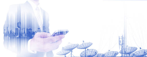 istock Double exposure businessman using smart phone with satellite dishes 639441870