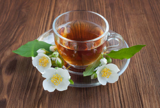 istock Tea in a glass cup with jasmine flowers 639442250