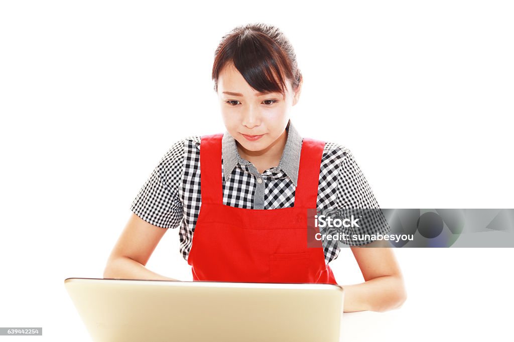 Smiling woman using a laptop Woman who enjoy the laptop computer 20-29 Years Stock Photo