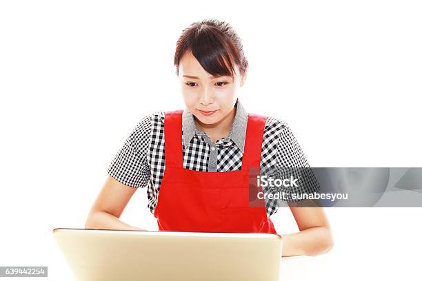 Smiling Woman Using A Laptop Stock Photo - Download Image Now - 20-29 Years, Adult, Adults Only