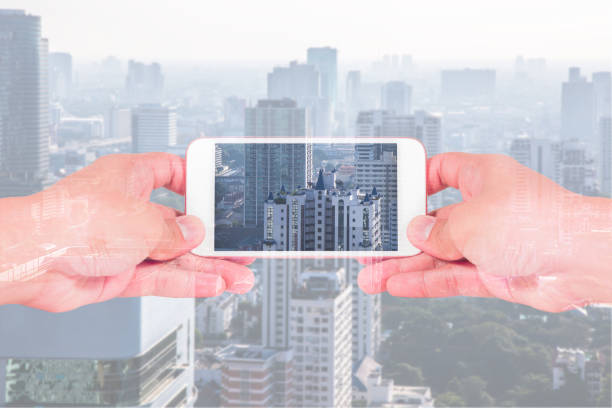 istock double exposure of man use two hand hold smartphone, cellphone 639444914