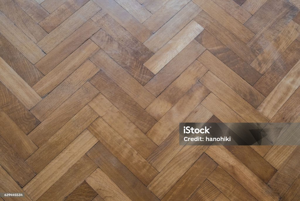 herringbone parquet floor - old wooden floor Parquet Floor Stock Photo