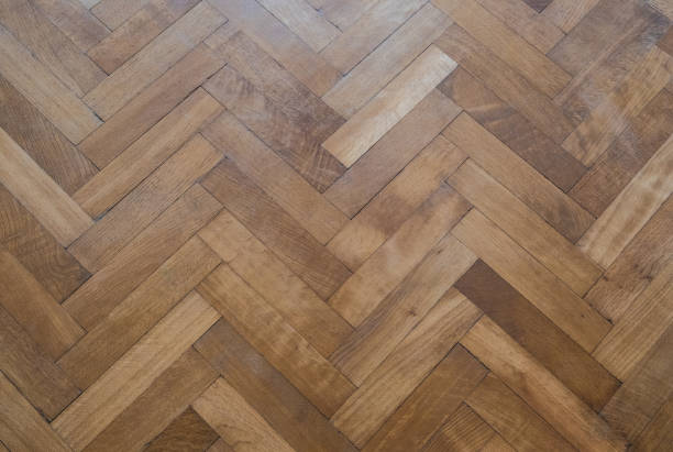 herringbone parquet floor - old wooden floor stock photo