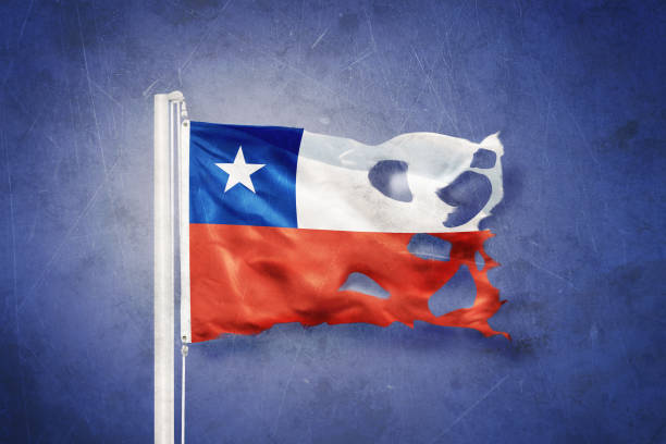 istock Torn flag of Chile flying against grunge background 639445580