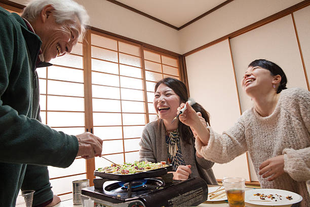 Family making Takoyaki for lunch/dinner Family making Takoyaki for lunch/dinner takoyaki photos stock pictures, royalty-free photos & images