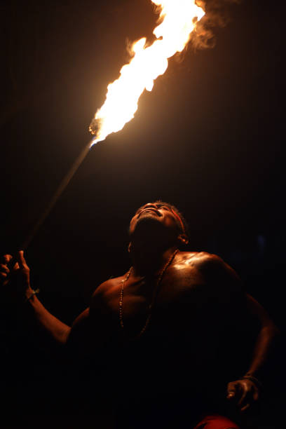 istock Indigenous Fijian man holds torch during a fire dance 639447828