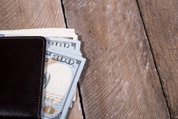 istock wallet full of dollars 639448826