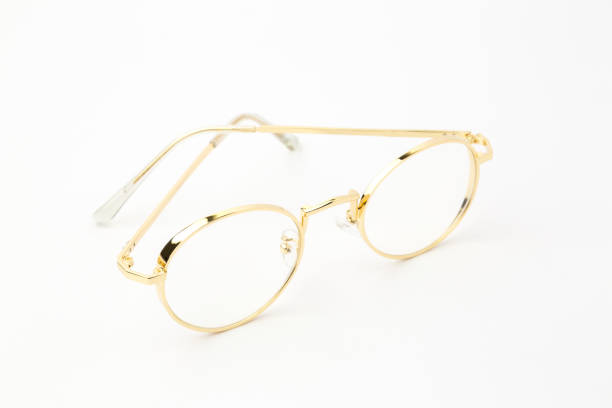 istock Classic gold round glasses on white background. 639449158