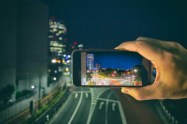 istock Shooting the city lights with a mobile device 639450524
