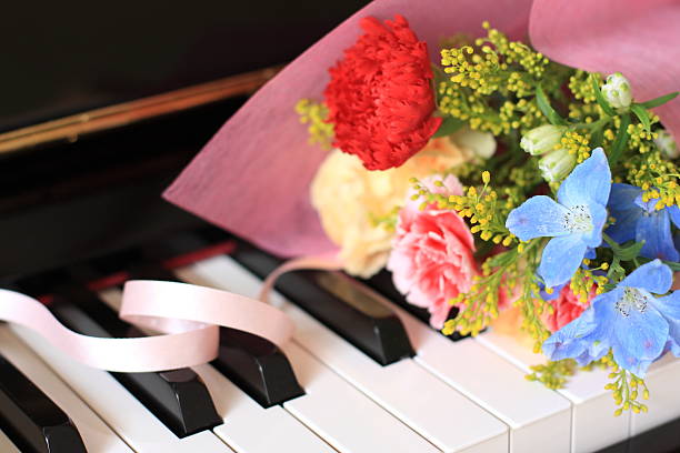 istock carnation bouquet on piano keyboard 639452202
