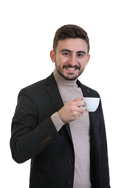 istock Young business man drinking coffee / tea 639454326