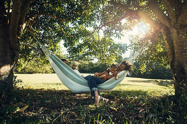 this hammock is family-sized - hammock imagens e fotografias de stock