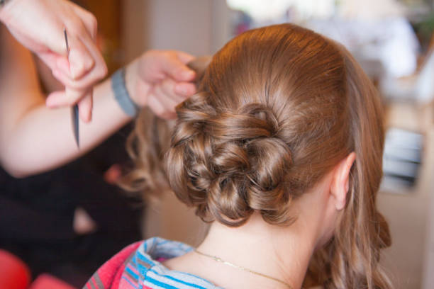 istock Bride gets the hair put up 639456354
