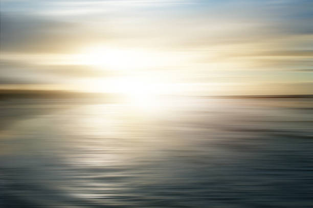 Abstract seascape with panning motion combined with a long exposure. Image displays soft, pastel colors in a retro style.