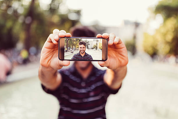 istock Young man showing selfie to the camera 639456778