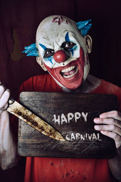 istock evil clown and text happy carnival 639457144