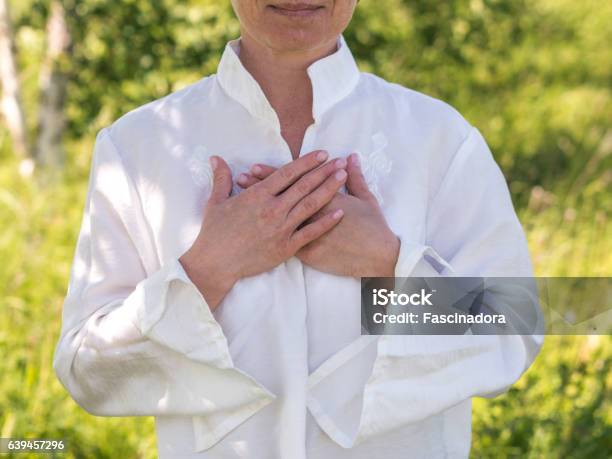 Relaxing Heart Stock Photo - Download Image Now - Hand On Heart, Women, One Woman Only