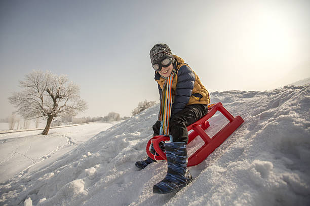 istock Cheerful sledding and having fun on snow 639457300