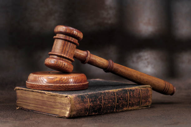 istock Law gavel on old brown leather book 639460106