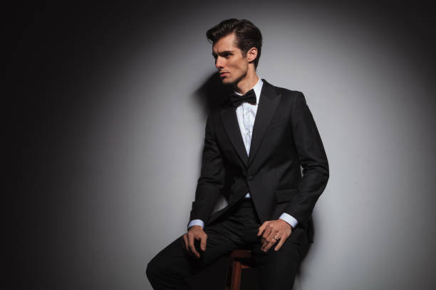 istock seated man wearing tuxedo and bowtie, with copyspace 639460584
