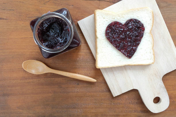 istock Toast with jam in shape of hearts.Top view 639460984
