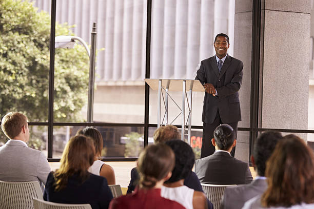 istock Black businessman presenting seminar smiling to audience 639466556