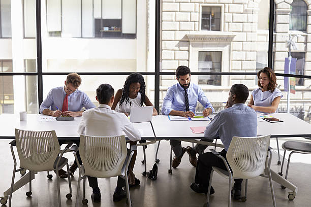 istock Corporate business team working in a modern open plan office 639467884