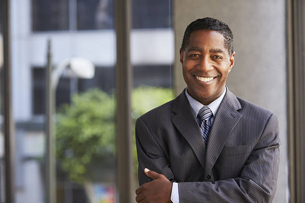 istock Middle aged black businessman looking at camera 639468212