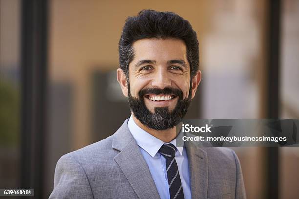 Happy Middle Aged Hispanic Businessman Looking To Camera Stock Photo - Download Image Now