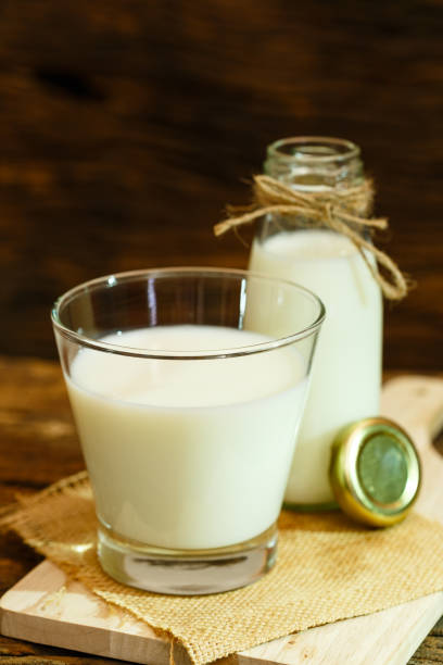istock Milk on wood plate and wood background 639469090