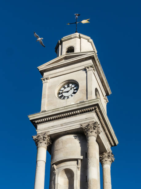 herne bay clock tower und möwe - herne stock-fotos und bilder