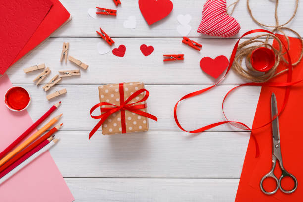 istock Valentine day handmade present background, cut and paste hearts card 639471296