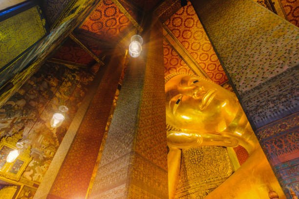 istock Reclining golden Buddha statue 639475718