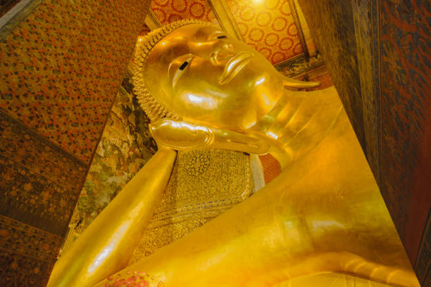 istock Reclining golden Buddha statue 639475826