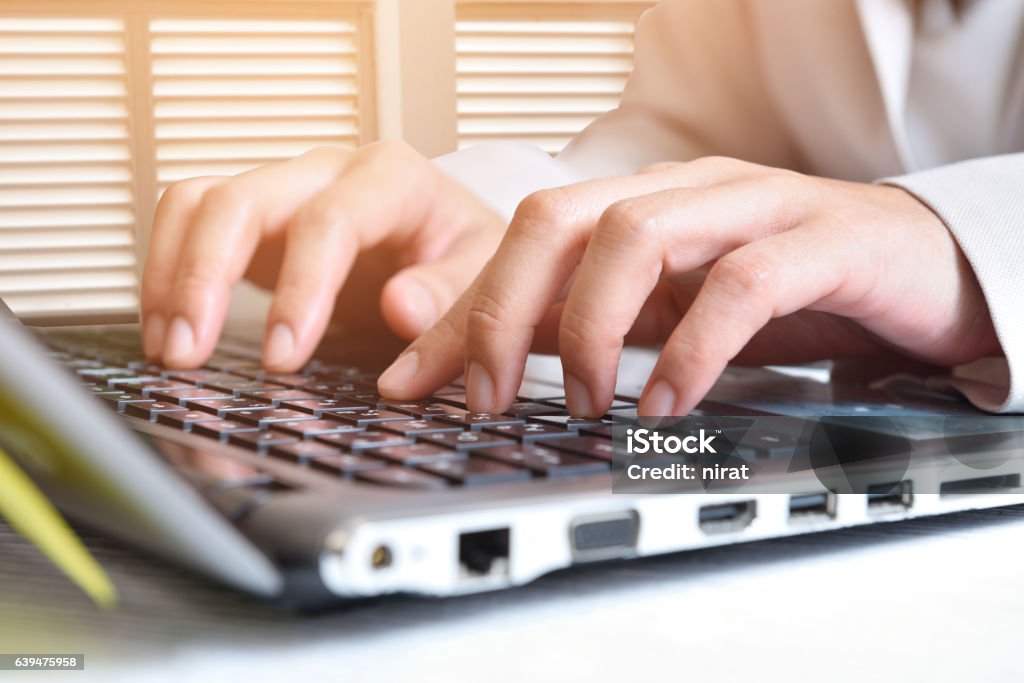 Data entry Data entry,Women key information into the computer. Building Entrance Stock Photo