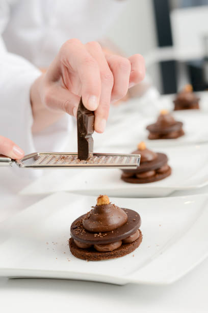 istock close up professional pastry cook hands preparing chocolate dessert restaurant 639476878