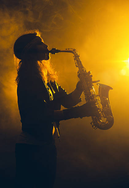 istock Female Saxophone Player 639477016