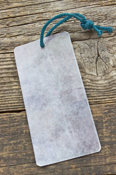 istock Blank price tag on wooden background 639479890