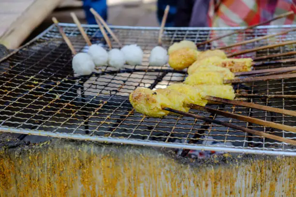 Sticky rice with egg grilled Asian traditional food, selective focus