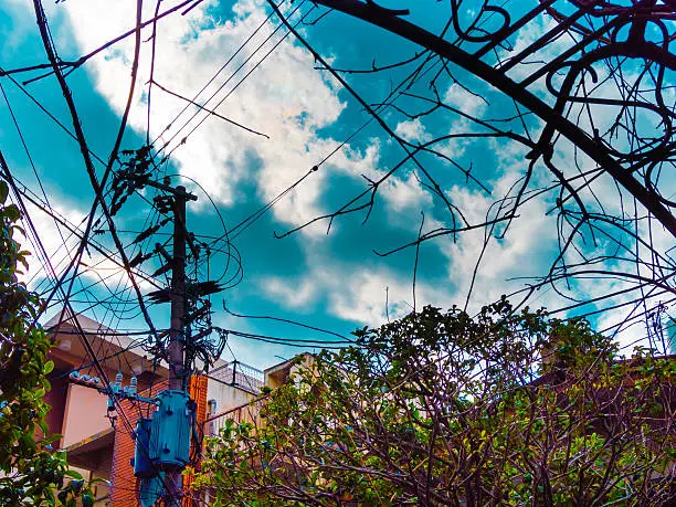 Utility pole in blue sky