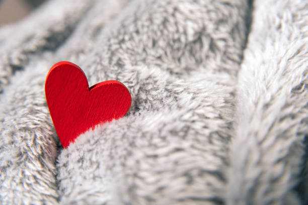 istock Valentines day red heart on bedspread 639485852